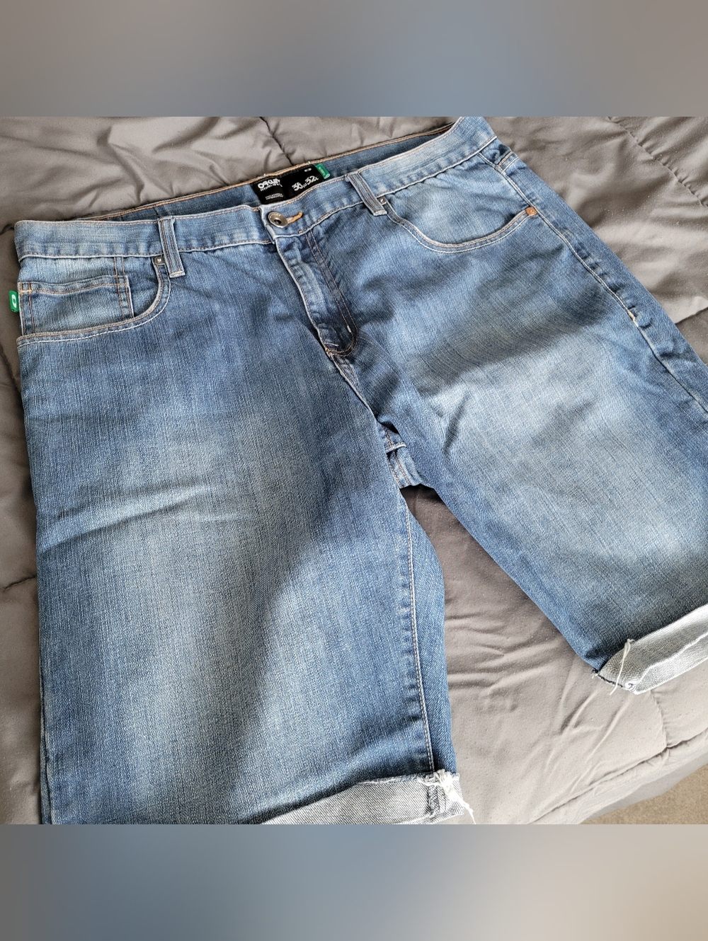 Oakley Light Blue Denim Jeans with Black Embossed Logo Patch